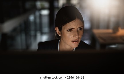 But I Restarted You...how Could You Not Be Working. Shot Of A Young Businesswoman Experiencing Stress During A Late Night In A Modern Office.