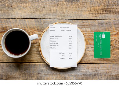 Restaurant Bill, Card And Coffee On Wooden Table Background Top View