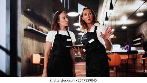 Restaurant Business Employee Education. Staff Meeting In Cafe - Powered by Shutterstock