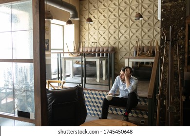 Restaurant, cafe, bar closed due to COVID-19 or Coronavirus outbreak lockdown, stressed owner of small business, depressed, despair. Businessman exhausted, upset. Business, economy, finance crisis.