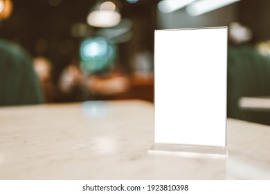 Restaurant Cafe Menu. Menu Frame Standing On Wood Table In Bar Restaurant Cafe. Space For Text Marketing Promotion