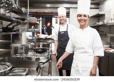 Restaurant, chef and portrait of people in kitchen for hospitality service, teamwork or career. Fine dining, cook and smile with collaboration in food industry for catering, job or culinary in France - Powered by Shutterstock