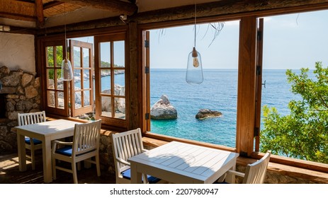 the restaurant at the cliffs looking out over the ocean of Fethiye, Faralya coast Fethiye Turkey during sunset