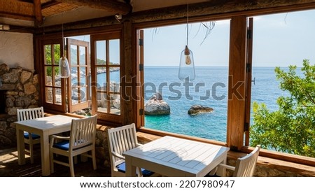 the restaurant at the cliffs looking out over the ocean of Fethiye, Faralya coast Fethiye Turkey during sunset