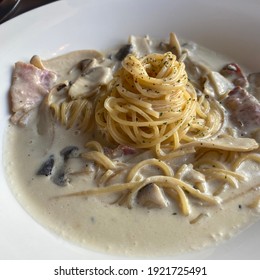 Restaurant Cuisine With White Cream Pasta Bacon Mushrooms