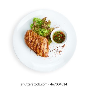 Restaurant Food - Chicken Fillet Grilled Steak Isolated On White Background. Big Piece Of Meat With Lettuce On White Round Plate Top View