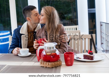 restaurant. a guy with a girl drink hot coffee and tea