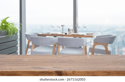Restaurant interior with empty wooden table close-up and panoramic window view on city skyscrapers. No AI used