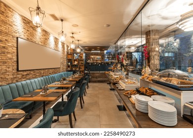 Restaurant interior with food buffet table - Shutterstock ID 2258490273