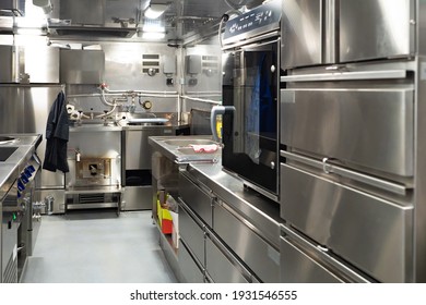 Restaurant Kitchen With Chrome Equipment. Kitchen Of Working Restaurant Without People. Equipment For Fast Food Restaurant. Equipment For Confectionery Shop. Professional Kitchen Furnishing For Cafe