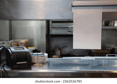 Restaurant kitchen with order and receipt printer - Powered by Shutterstock