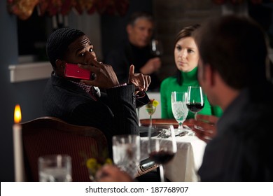 Restaurant: Man Annoyed With Other Diner Using Phone - Powered by Shutterstock