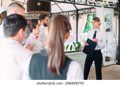 Restaurant Manager And His Staff In Terrace. Interacting To Head Chef In Restaurant