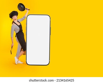 Restaurant Mobile App. Cook Is Dancing Near Giant Phone. Mockup Of Giant Phone On Yellow. Template For Showcasing Restaurant App. Mockup For Website Design In Smartphone. Promotional Offer From Chef