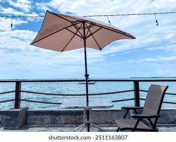 restaurant outdoor besides the beach, beachfront cafe. - Powered by Shutterstock