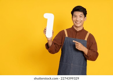 Restaurant owner sme young Asian man holding number 1 or one isolated on yellow background - Powered by Shutterstock