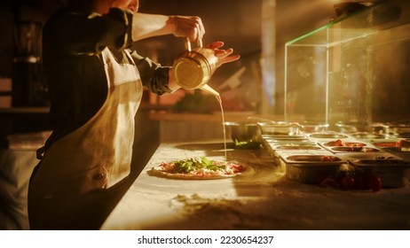In Restaurant Professional Female Chef Preparing Pizza, Adding Ingredients, Special Sauce, Cheese. Cooking by Traditional Family Recipe. Authentic Sunny Italian Pizzeria with Delicious Organic Food