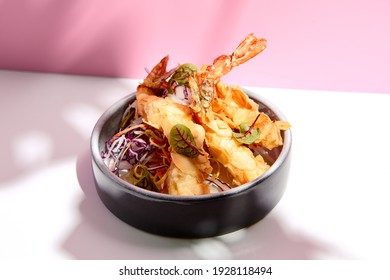 Restaurant Seafood - Tempura Shrimp And Almond And Cabbage Salad. Appetizer Food Plate On White Table With Pink Wall. Day Sunlight With Hard Shadow Of Monstera Palm Leaves. Summer, Spring Food Concept