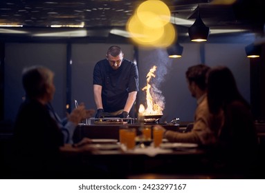 In a restaurant setting, a professional chef presents a sizzling steak cooked over an open flame, while an European Muslim family eagerly awaits their iftar meal during the holy month of Ramadan - Powered by Shutterstock