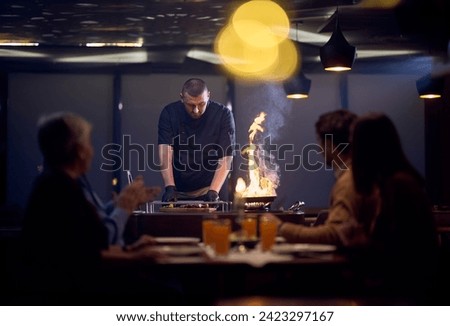 In a restaurant setting, a professional chef presents a sizzling steak cooked over an open flame, while an European Muslim family eagerly awaits their iftar meal during the holy month of Ramadan