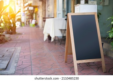 Restaurant Sidewalk Chalkboard Sign Board. Empty Black Board (menu Board) At A Restaurant With Space For Text