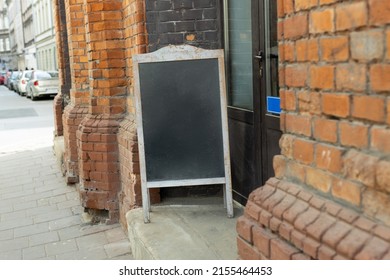 Restaurant Sidewalk Chalkboard Sign Board. Old Blak Signboard On The Street. Blank Store Signage Sign Design Mockup Isolated, Clear Shop Template.