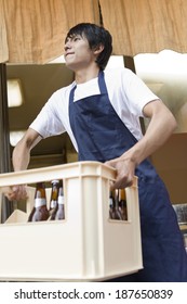 Restaurant Staff Carrying Beer Case