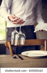 Restaurant Staff Setting Table in Restaurant for Reception