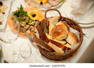 restaurant table, bread in a basket