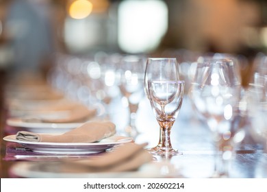 Restaurant With Table Settings For A Dinner Party