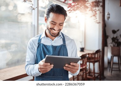 Restaurant, tablet and happy man or small business owner, e commerce and online cafe or coffee shop management. Waiter or asian person reading sales on digital technology or internet for his startup - Powered by Shutterstock