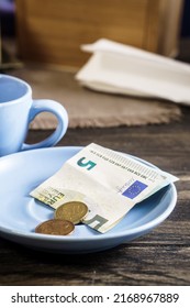 Restaurant Tips Or Gratuity, Euro Banknotes And Coins On Plate