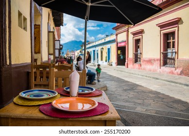 Restaurant view and sidewalk on San Cristobal de las Casas colonial town. Latin American Culture.