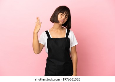 Restaurant Waiter Over Isolated Pink Background With Tired And Sick Expression