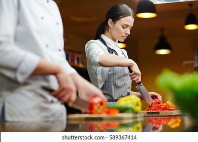 Restaurant Worker Cutting Fresh Pepper For Salad