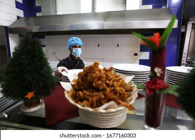 Restaurant Workers Wears A Mask On His Face While The Works At Of As A Precaution Against The Spread Of The COVID-19 Coronavirus,  In The Gaza Strip, On March 19, 2020. Photo By Abed Rahim Khatib