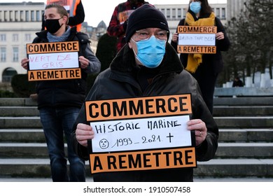 Restaurants owners hold placards as they attend in a protest against the government-ordered closure of their businesses amid the pandemic of the coronavirus disease in Brussels, Belgium on Feb. 5 2020