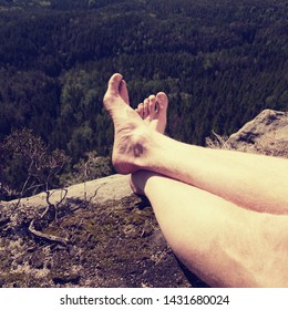 Resting Legs Within Mountain Running Trail. Hiker Watching Hilly Landscape Over Own Hairy Legs.