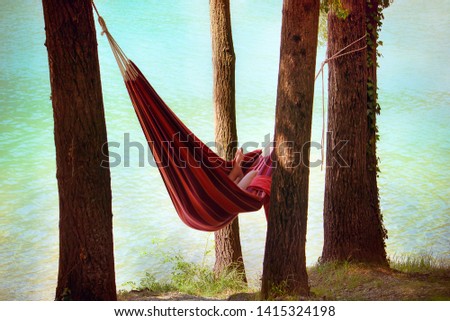 Similar – Foto Bild Young woman relaxing in a hammok