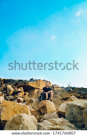 Similar – black haired man posing with sunglasses