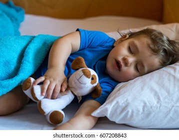 Restless Sleep Of A Baby With A Cold. The Kid Sleeps With His Mouth Open