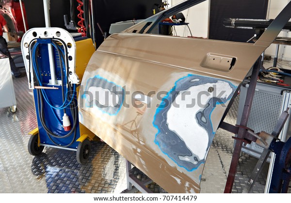 Restoration of door and painting in the car\
service station