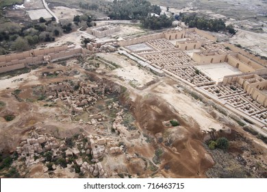 Restored Ruins Of The South Palace Of Nebuchadnezzar In Ancient Babylon, Iraq On The Right. Ruins Of The North Palace Damaged By US Occupation On The Left. Beyond Processional Street Is Ninmah Temple.