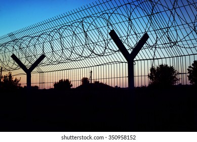 Restricted Area - Fence With Barbed Wire.