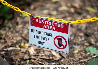 Restricted area sigh hanging on a chain outside  - Shutterstock ID 2287968925