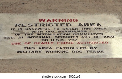 A Restricted Area Warning Sign On Ground At A US Airforce Base.