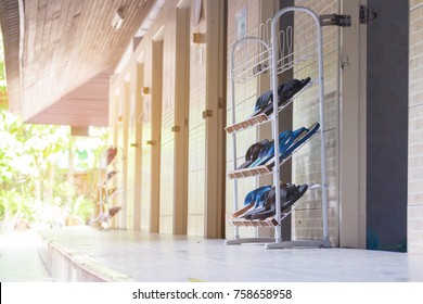 The Restroom With The Sandles On The Shoe Rack For Changing Before Get In