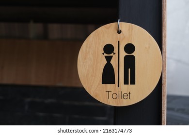 Restroom sign on a toilet door.Toilet sign - Restroom Concept - black tone.WC or Toilet icons set. Men and women WC signs for restroom with copy space for text.