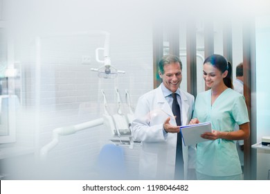 Results are ready! Dentist discussing with his assistant medical results in dentist’s office
 - Powered by Shutterstock