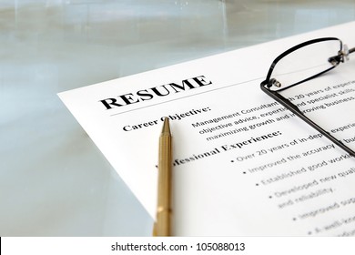 Resume on the Table. Closeup of resume with pen and glasses on the table - Shutterstock ID 105088013